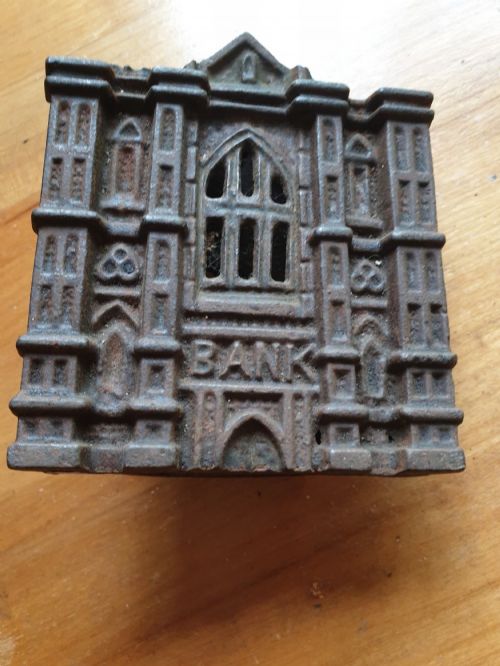 a late 19thc cast iron money bank in the form of a gothic bank