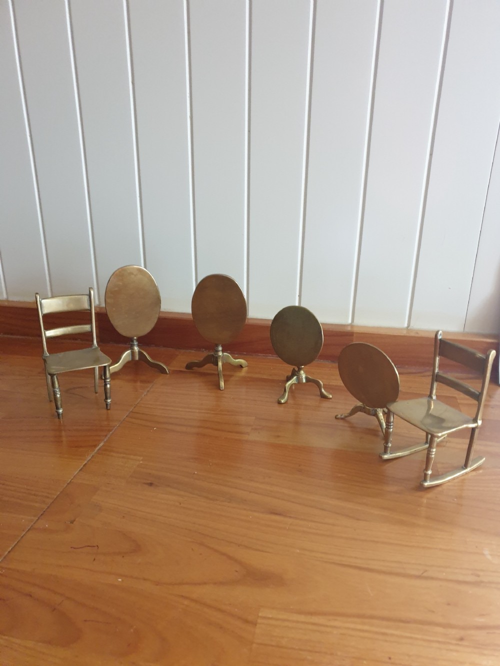 antique minature group of brass tripod tables and chairs six in total