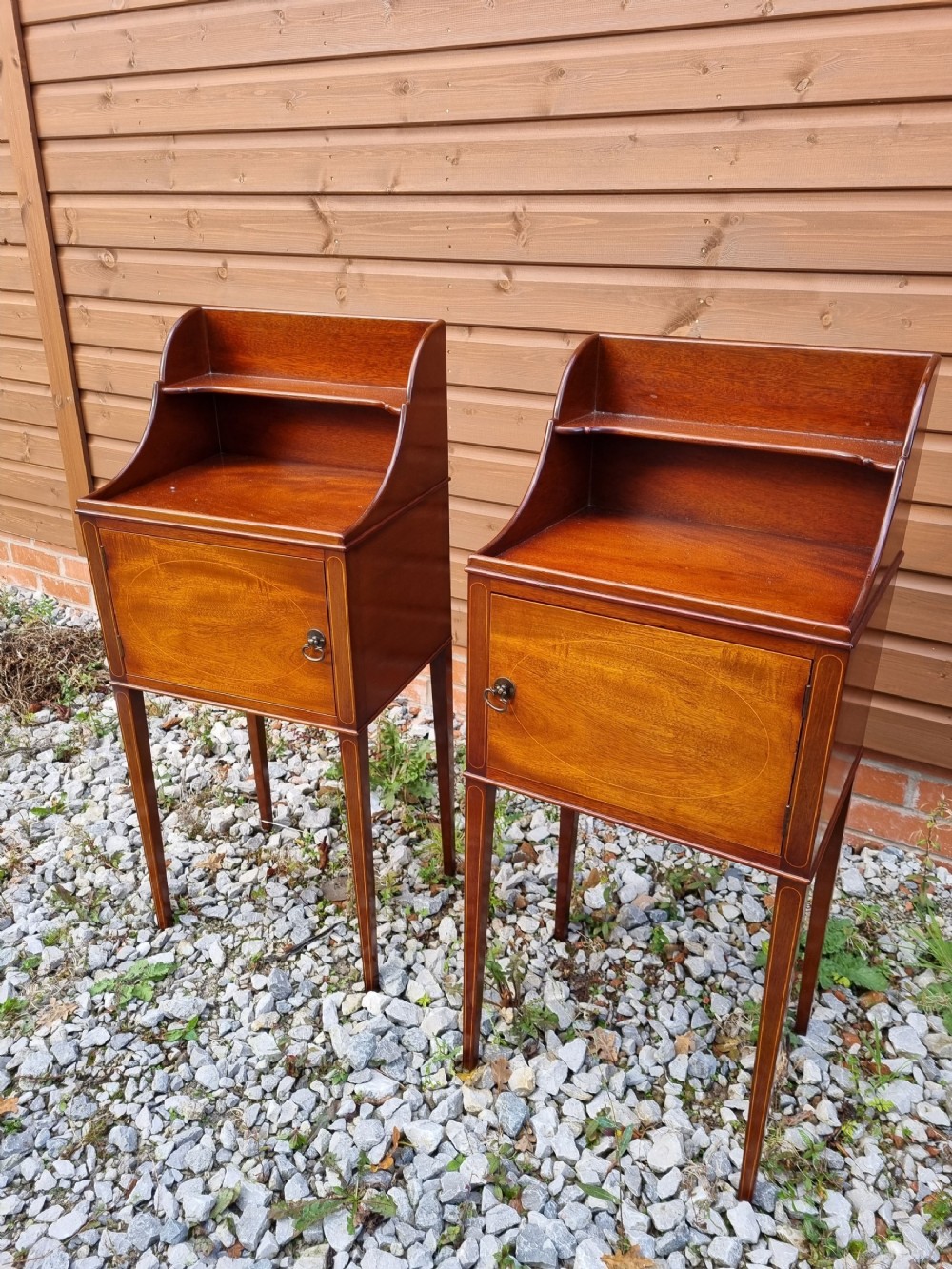 rare pair of matching inlaid mahogany bedside cupboards