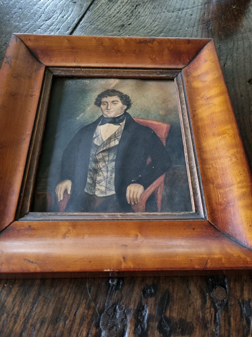 a naive 19thc watercolour of a country gent in a maple frame
