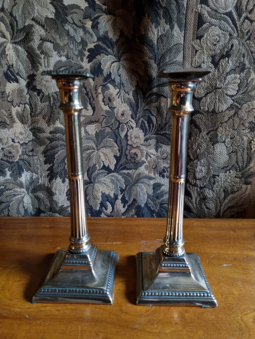 a pair of early 19thc classic adams style tall candlesticks