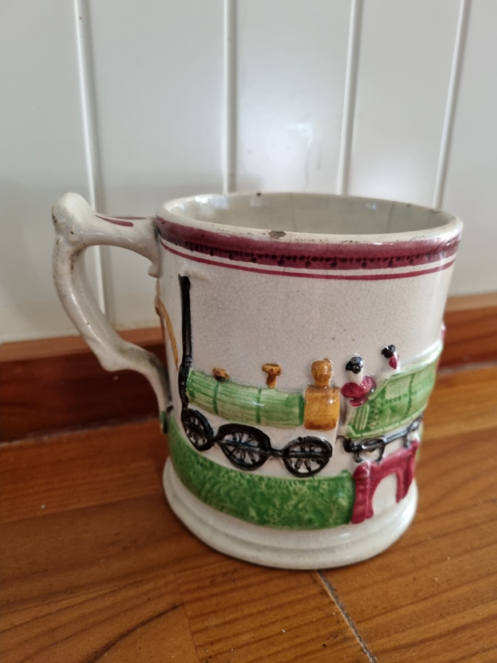 a rare primitive mid 19thc pottery mug of the rocket railwayania