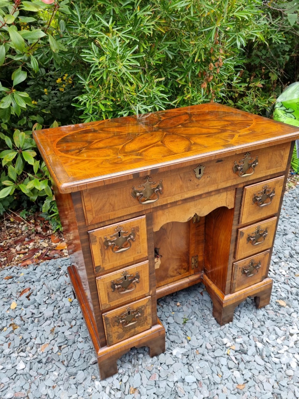 l17thce18thc small walnut oyster veneered kneehole desk