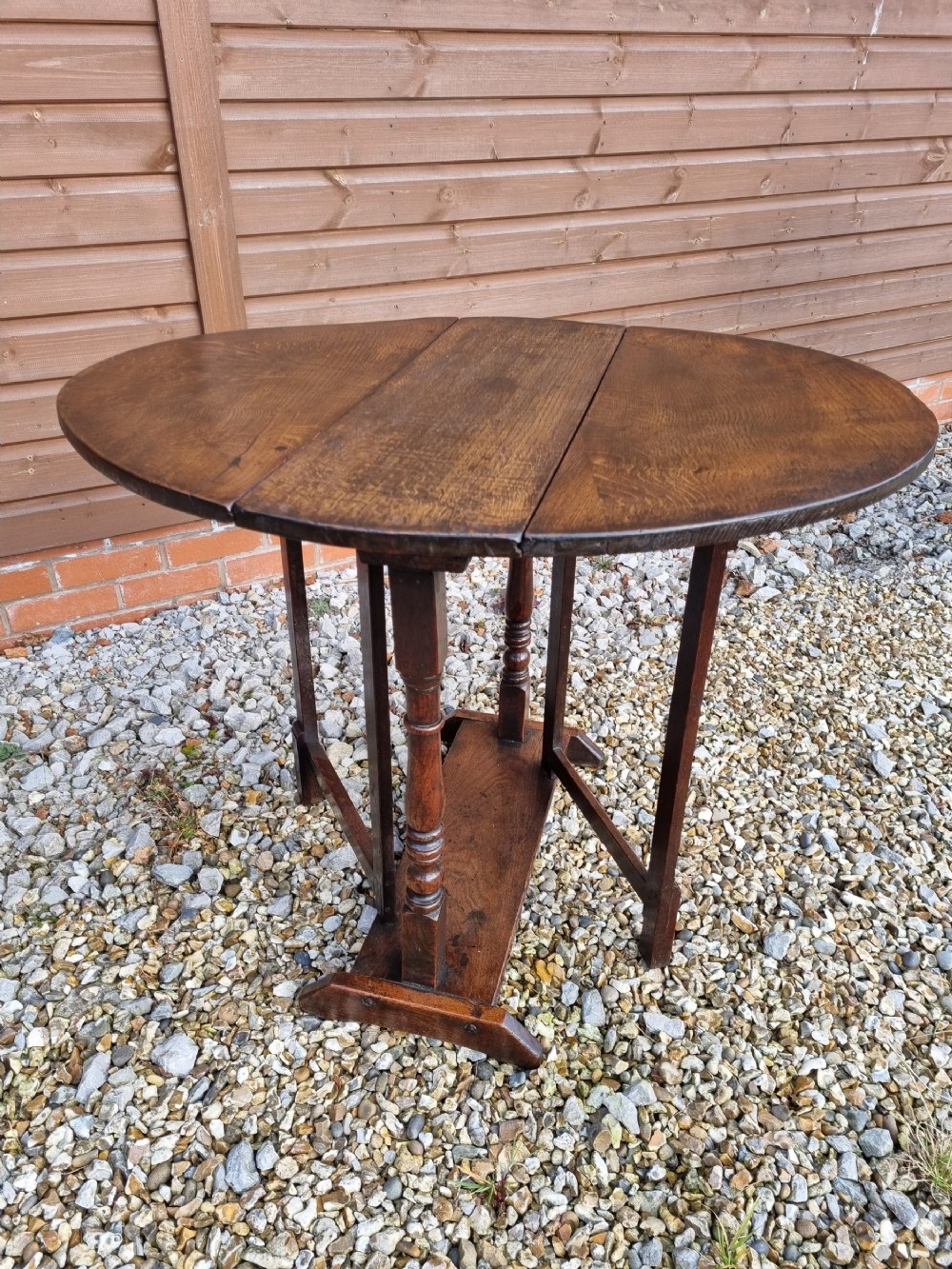 small well patinated e18thc oak gateleg table sleigh base