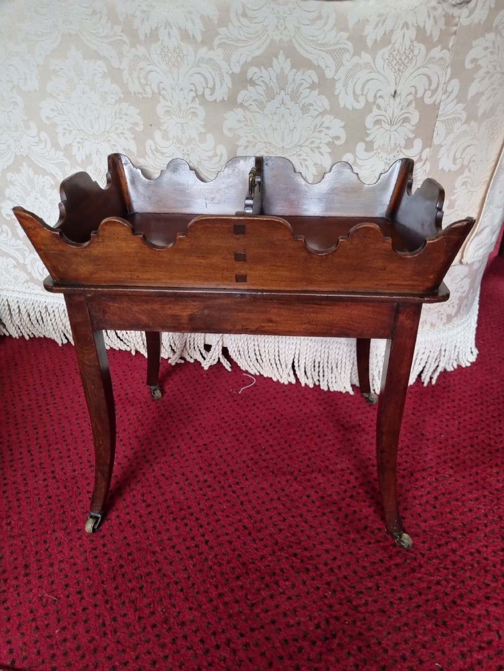 a 18thc original butlers stand on sabre legs